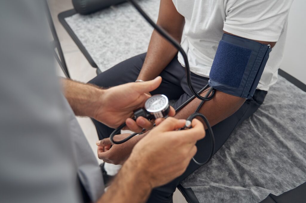 African American undergoing medical examination at clinic